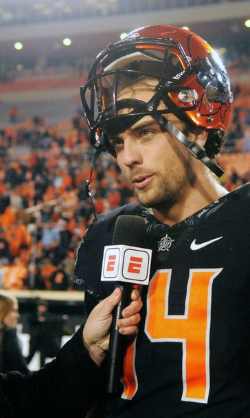 Cornelius leads Oklahoma St. past No. 7 West Virginia, 45-41